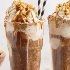 Two tall glasses of peanut butter whiskey floats