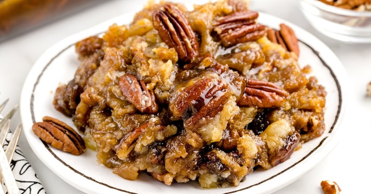 a close up shot of Pecan Dump Cake on a plate