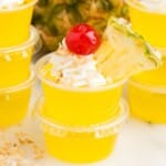 Stack of pina colada jello shots in cups