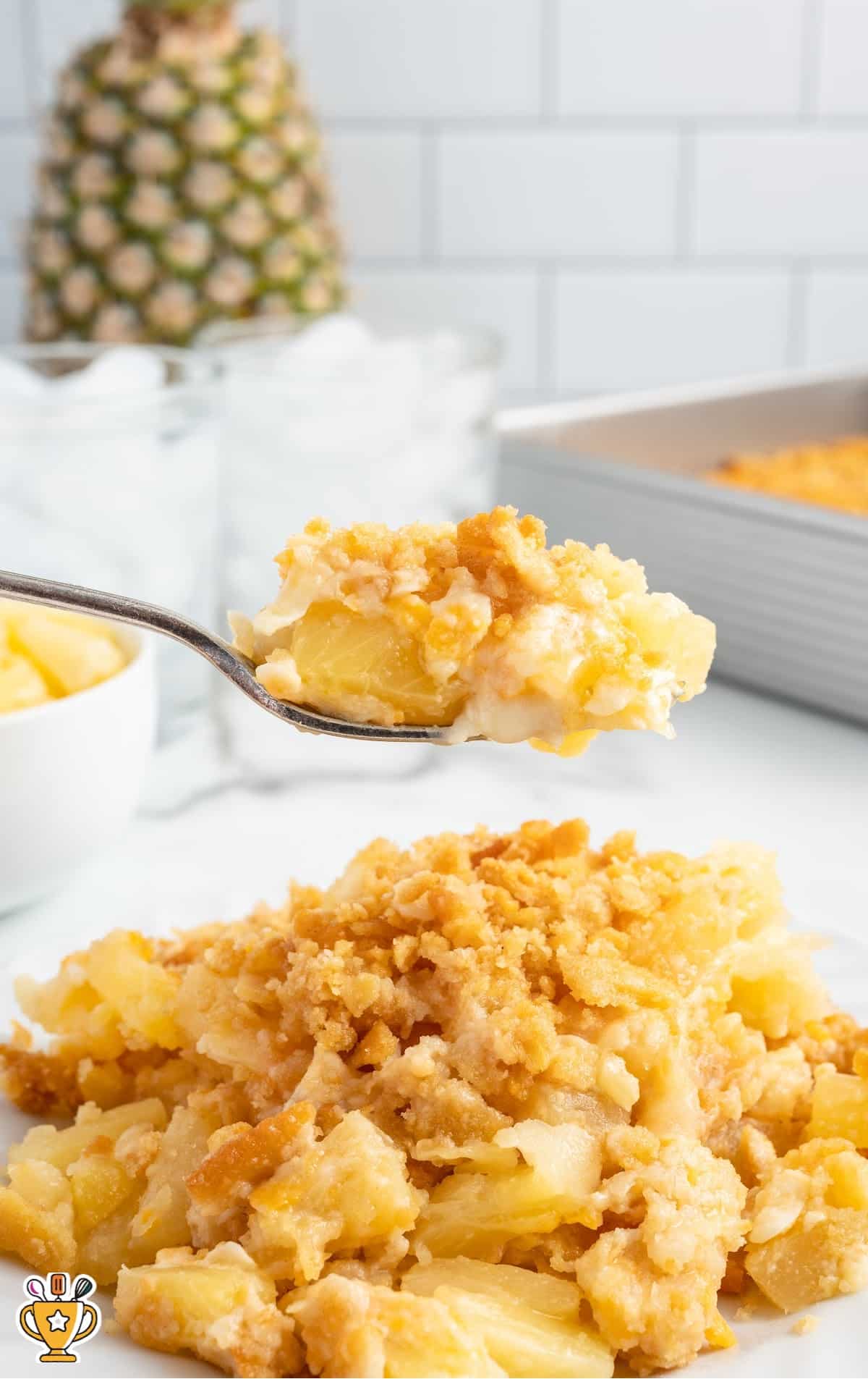 close up shot of broccoli and rice casserole on a wooden spoon