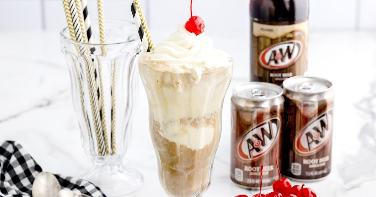 a close up shot of Root Beer Float in a tall glass