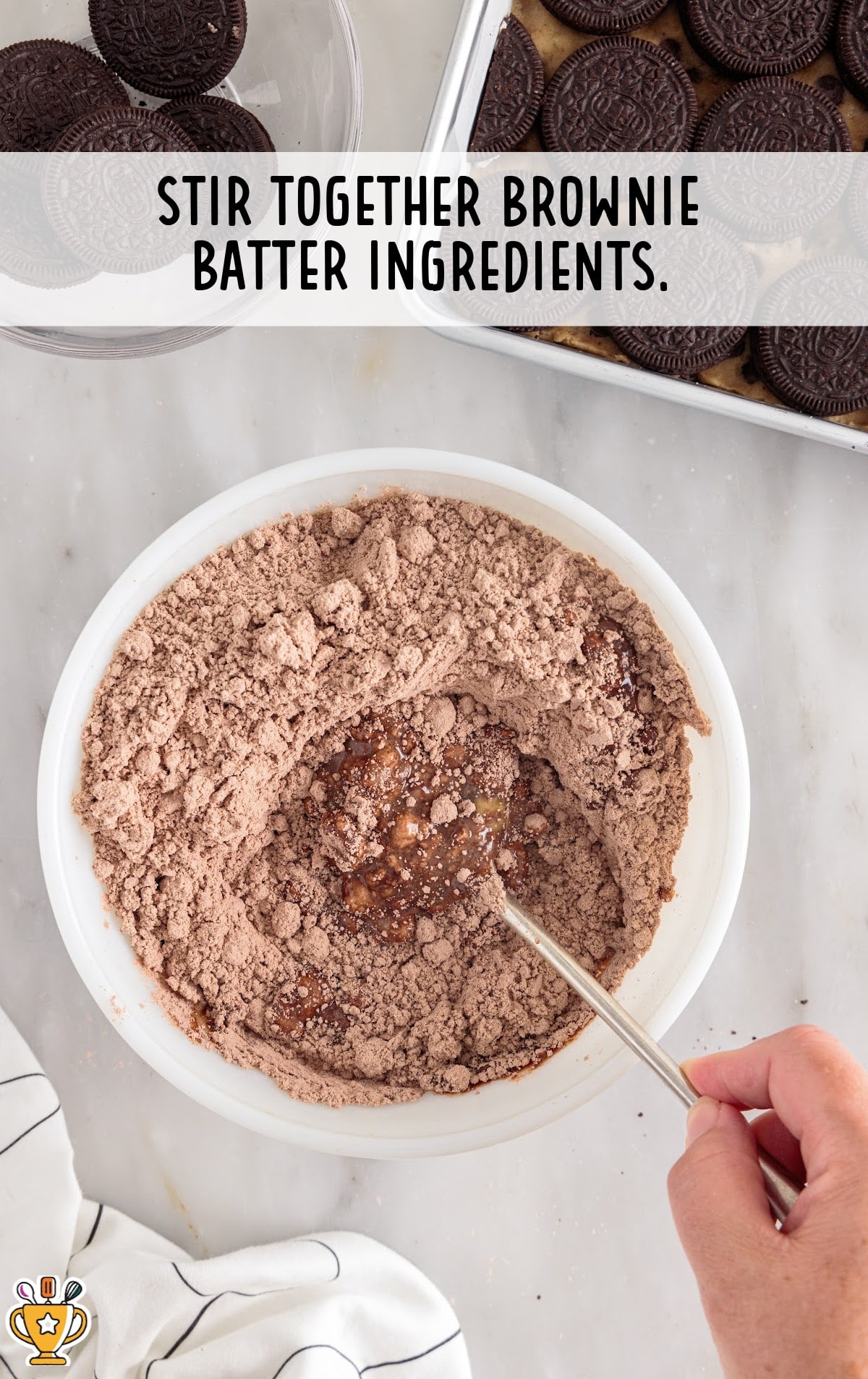 brownie batter ingredients stirred in a bowl