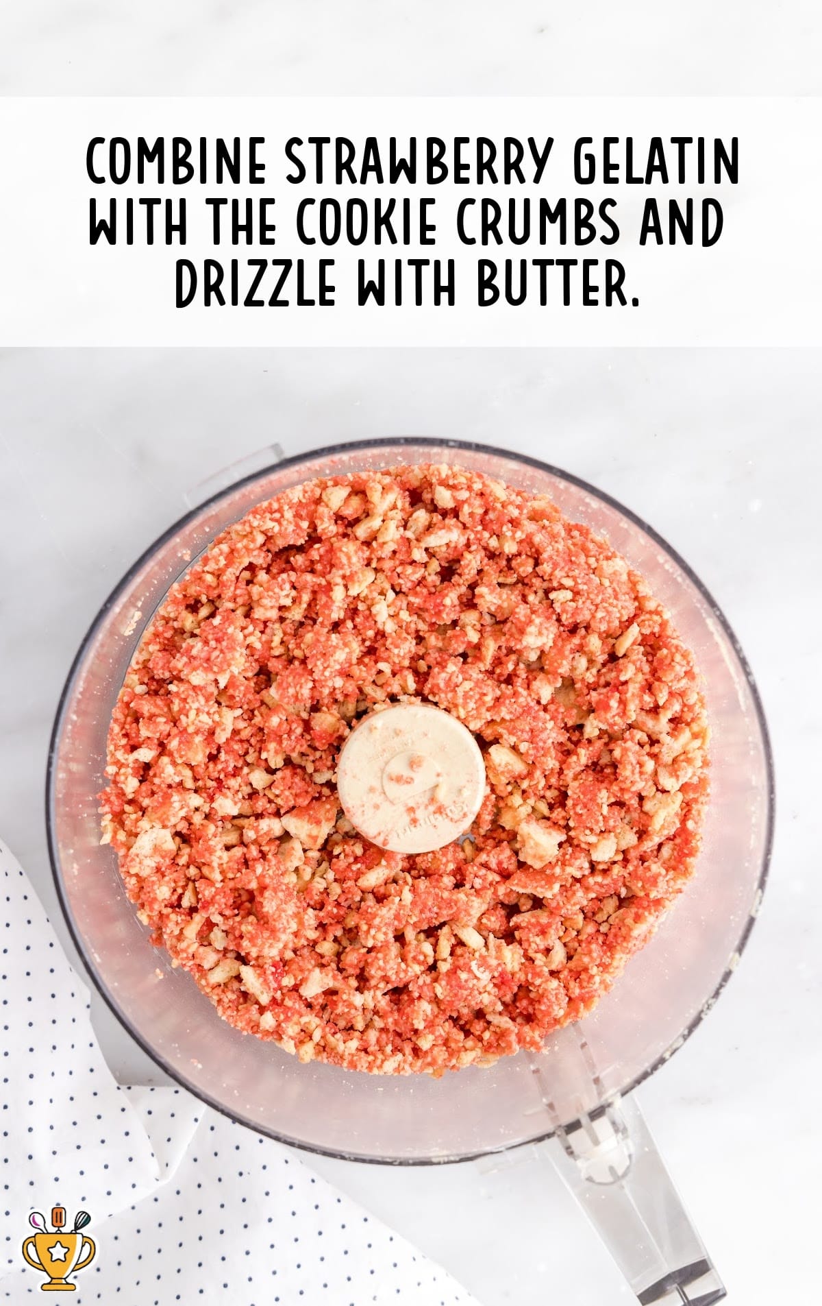 strawberry gelatin combined with cookie crumbs and drizzled with butter in a bowl