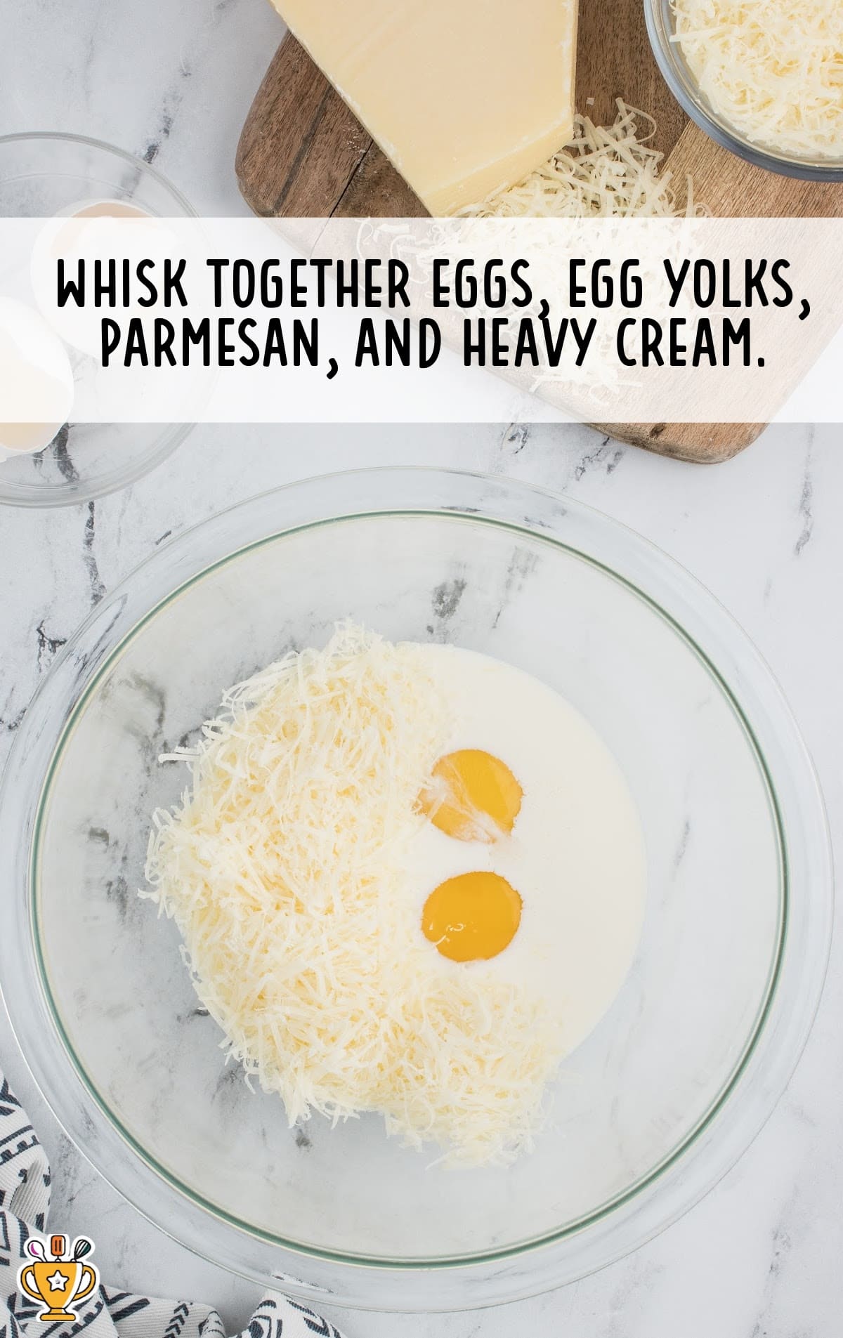 eggs, egg yolk, parmesan, and heavy cream whisked together