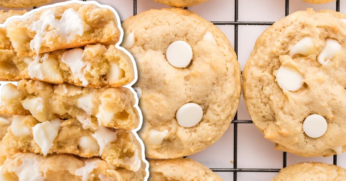 overhead shot of White Chocolate Chip Cookies on a baking sheet with a bowl of white chocolate chips
