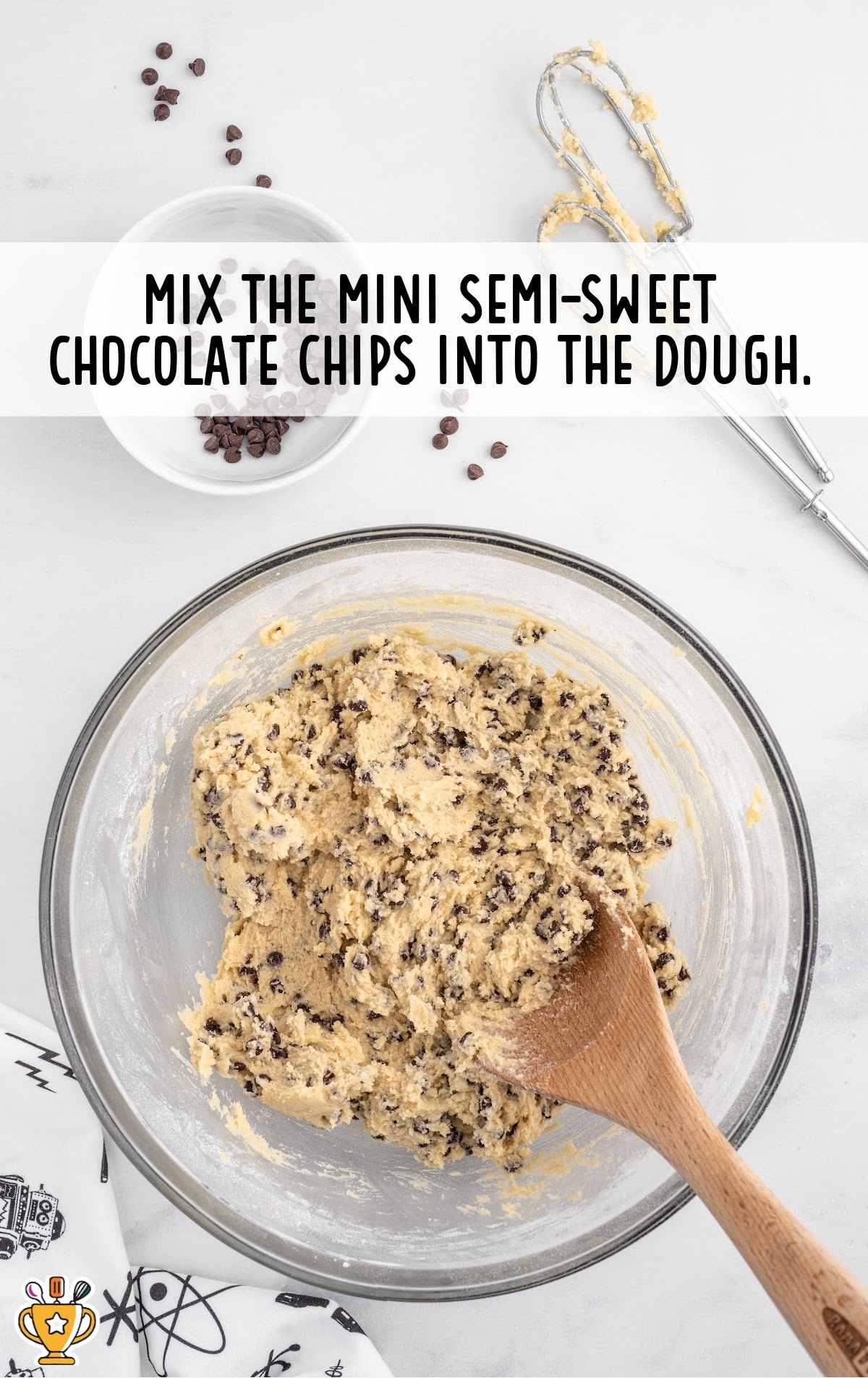 mini semi sweet chocolate chips combined with the dough in a bowl