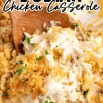 a close up shot of Million Dollar Chicken Casserole with a wooden spoon grabbing a piece