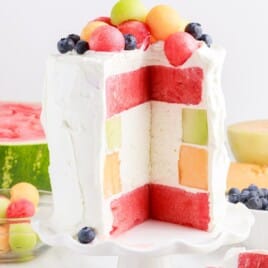 watermelon cake with a piece served from it