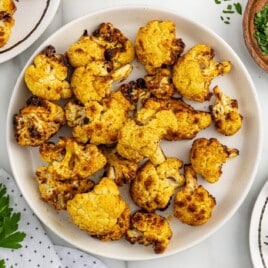 a serving dish full of cooked cauliflower.