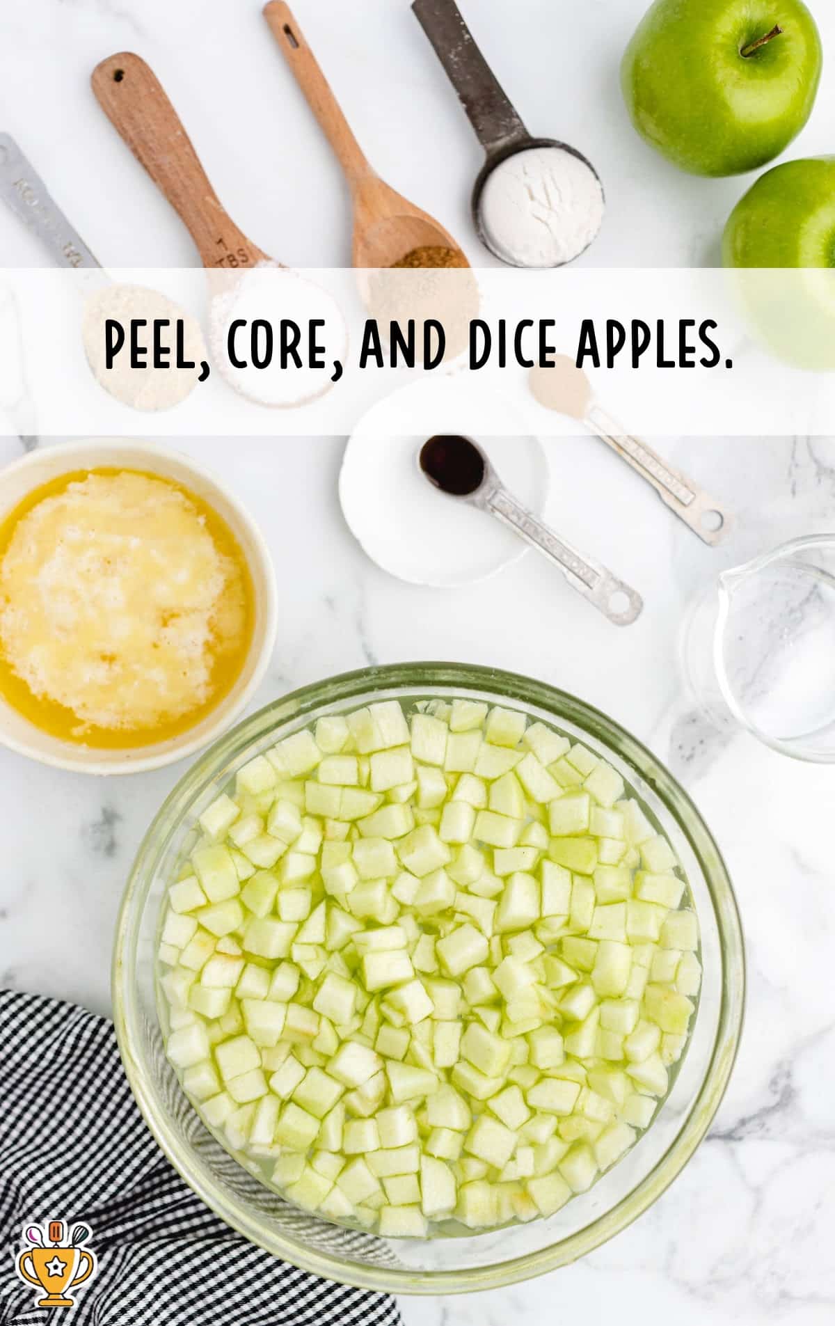 Chopped apples in a bowl of water.