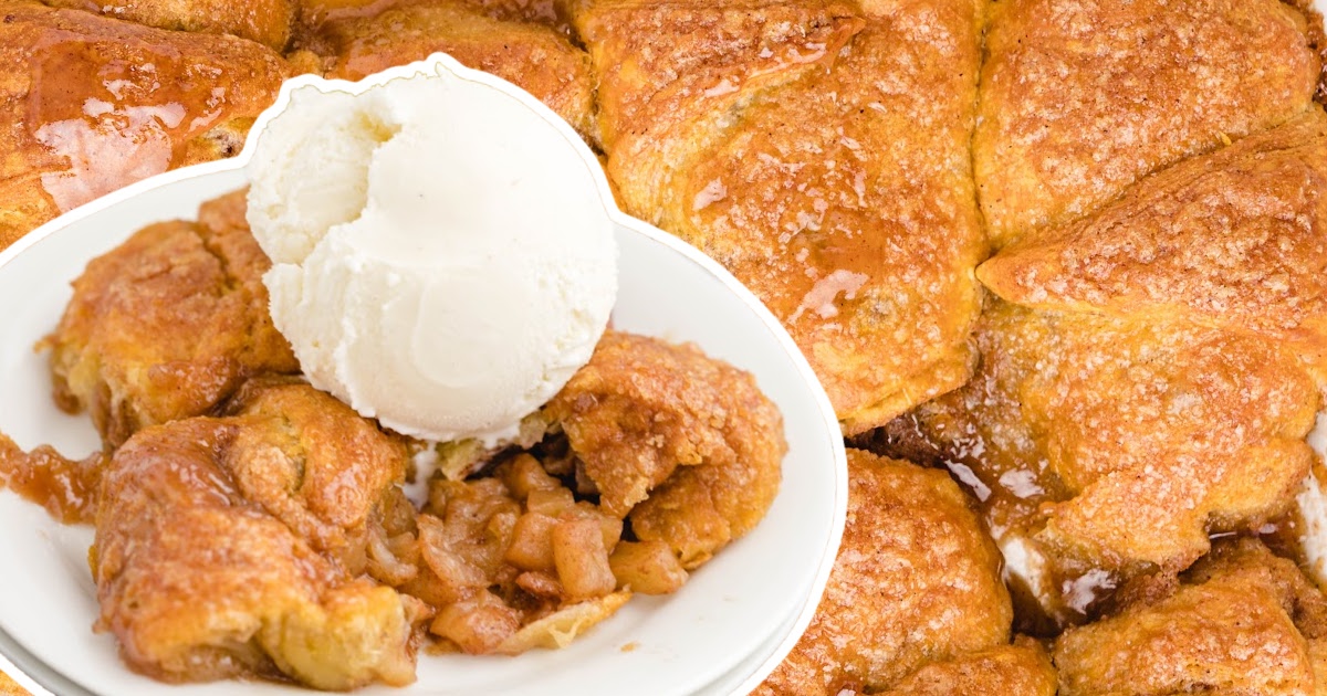 Apple dumplings with ice cream cut open with the apple filling spilling out.