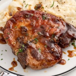 close up of a pork chop on a plate