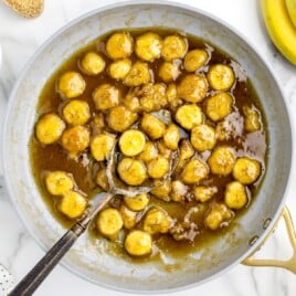 skillet full of bananas in gooey sauce