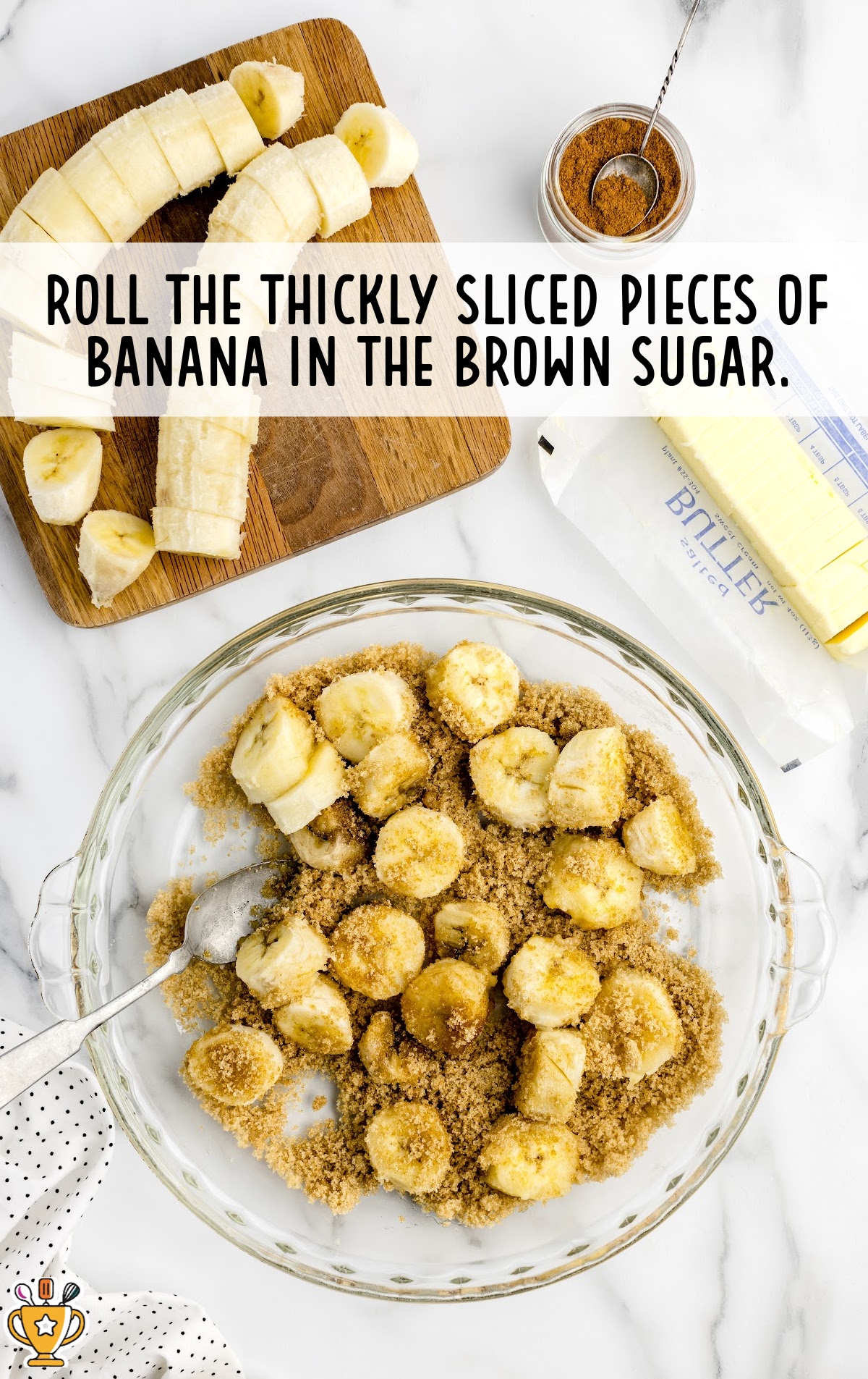 banana pieces being rolled in brown sugar