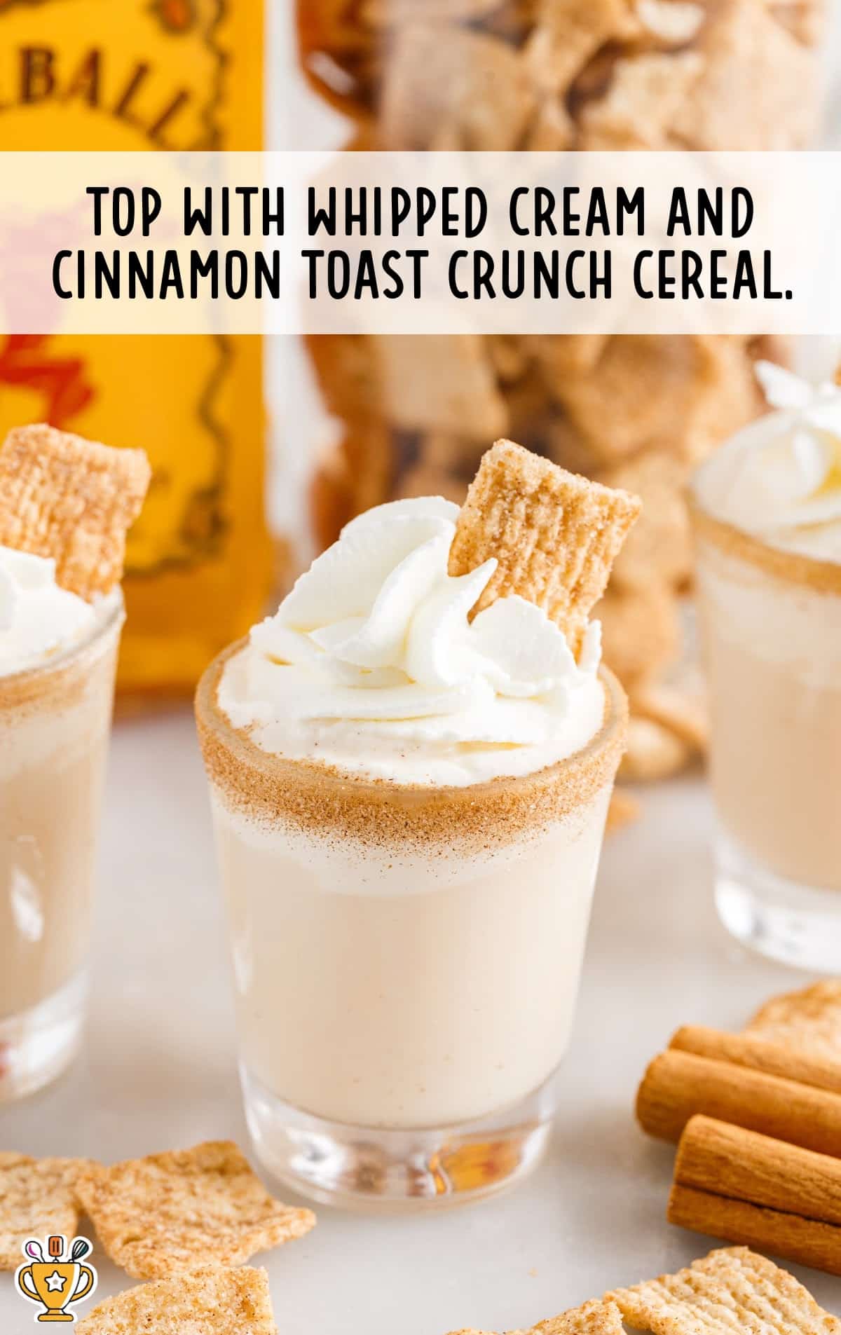 Cinnamon Toast Crunch Shot in a glass topped with whipped cream