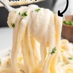 Copycat Olive Garden Alfredo sauce served over fettuccine pasta with creamy Parmesan sauce and fresh parsley.