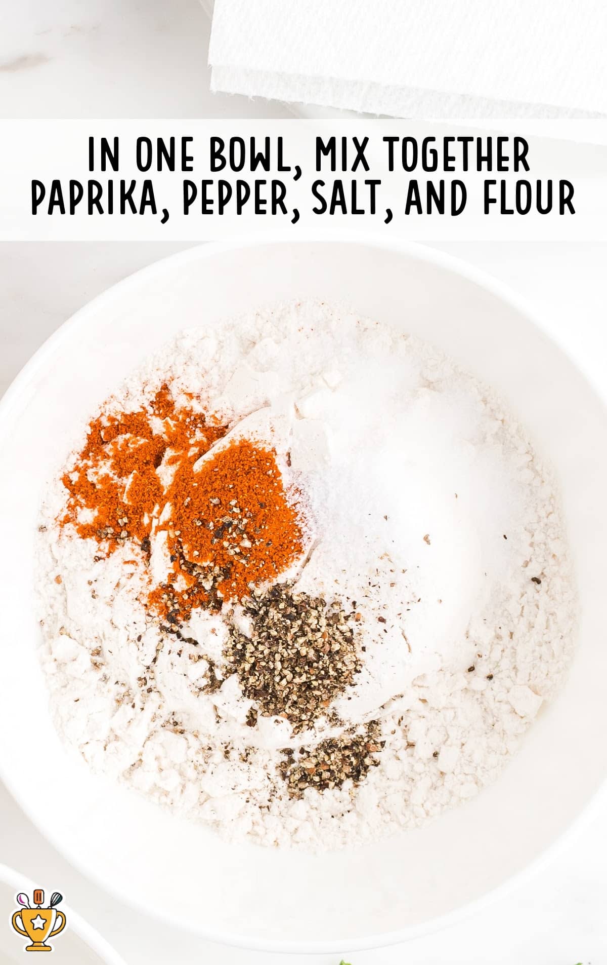 Paprika, pepper, salt and flour mixed in a bowl