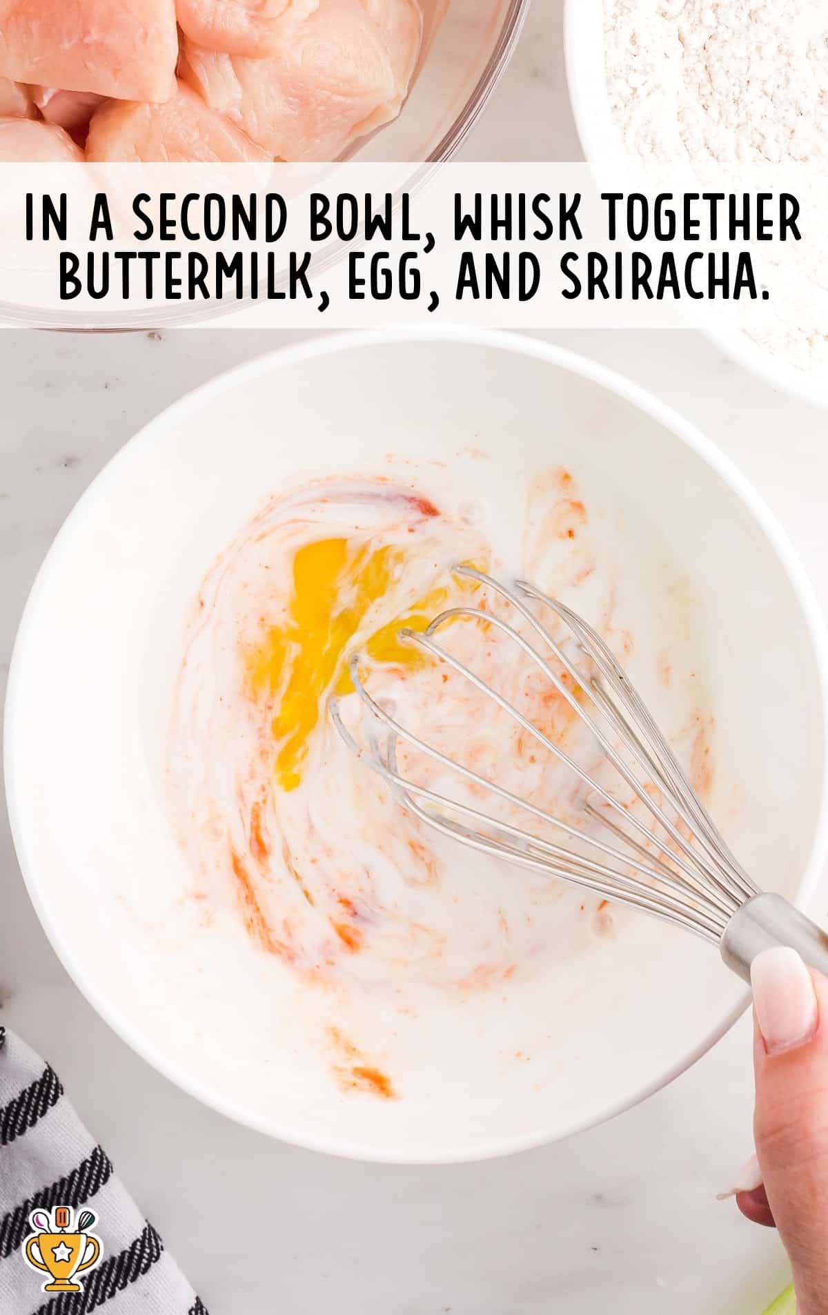 Buttermilk, egg and sriracha mixed together