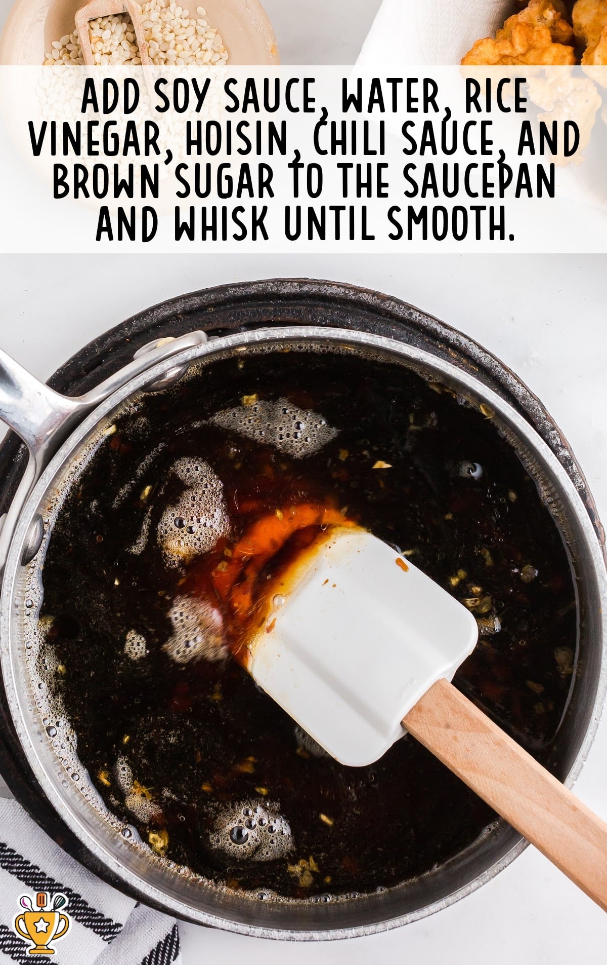 Soy sauce, water, rice, vinegar, hoisin, chili sauce and brown sugar added in the saucepan