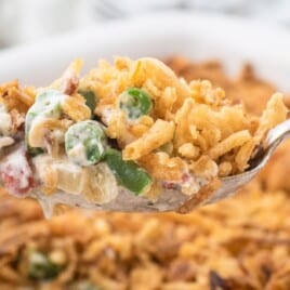 A spoon holding Green Bean Casserole