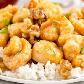 a plate of shrimp on a bed of rice.