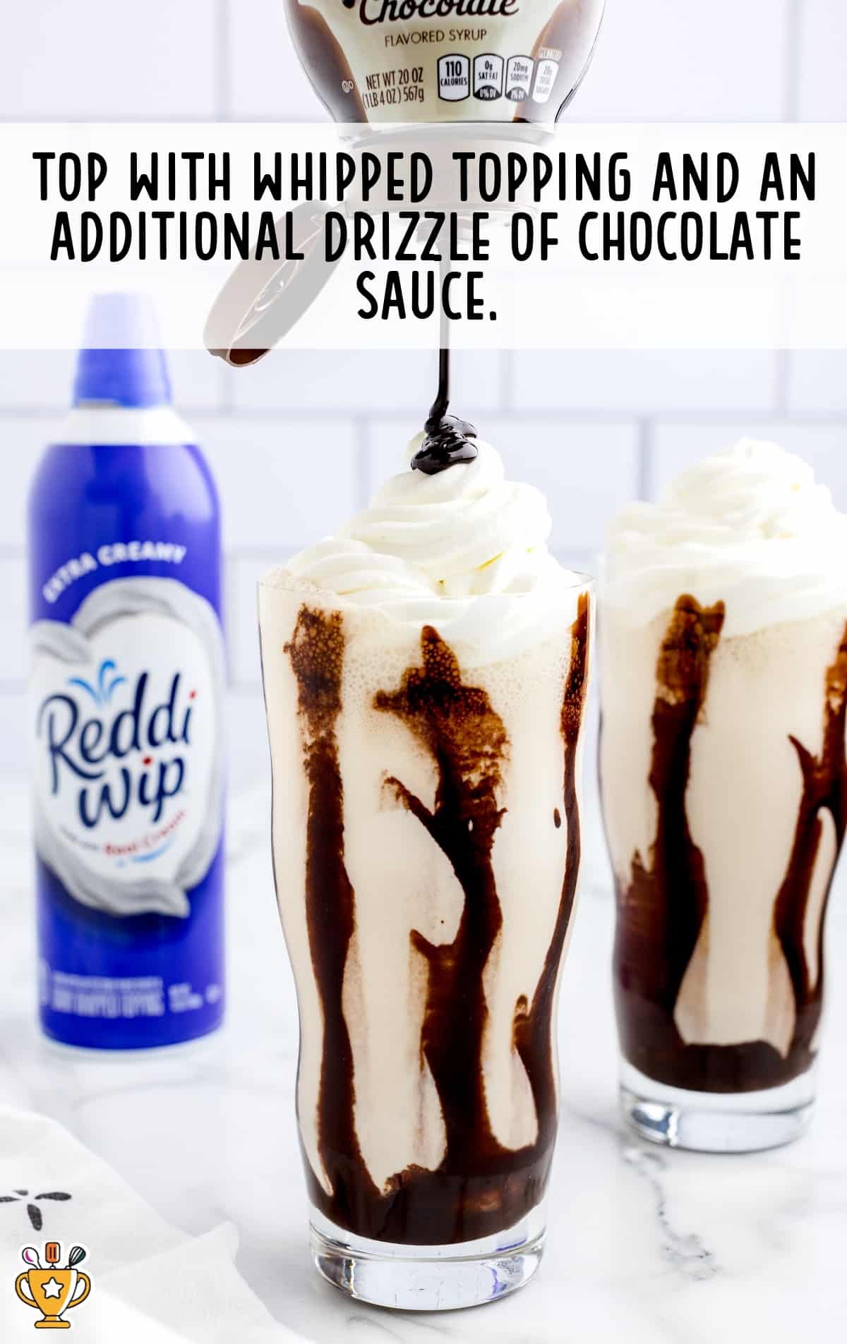 Mudslide drink topped with whipp topping and chocolate sauce