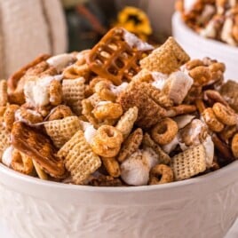 A white bowl full of Pumpkin Spice Chex Mix