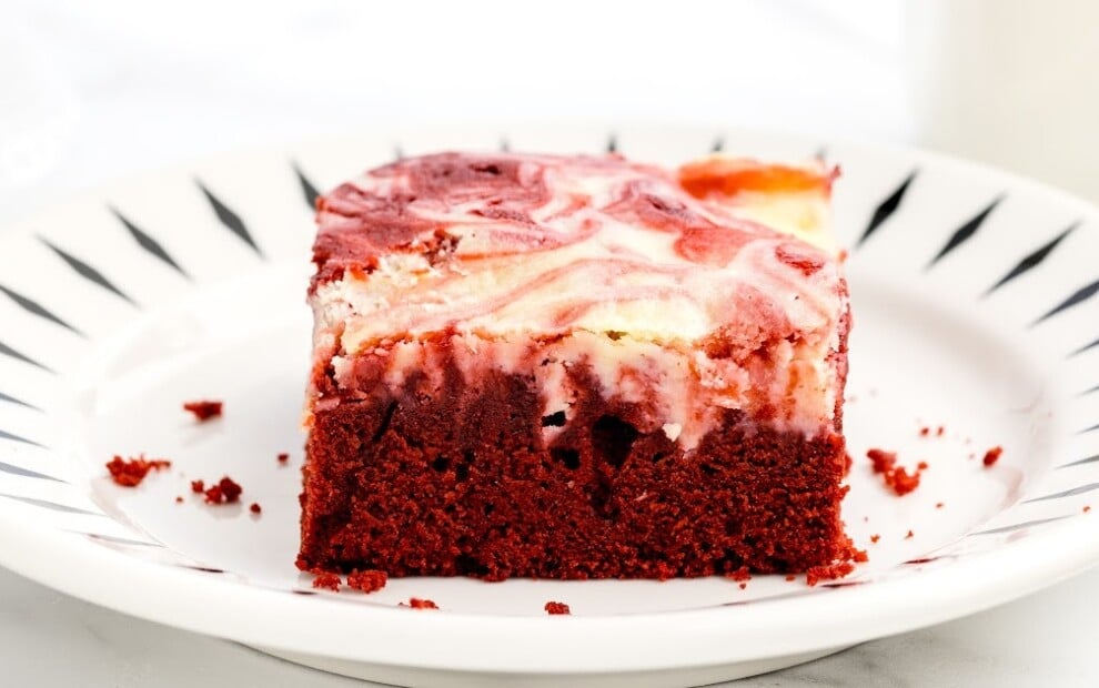 a white plate with a brownie on it.