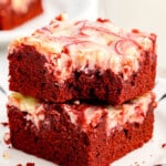 Two red velvet brownies stacked.