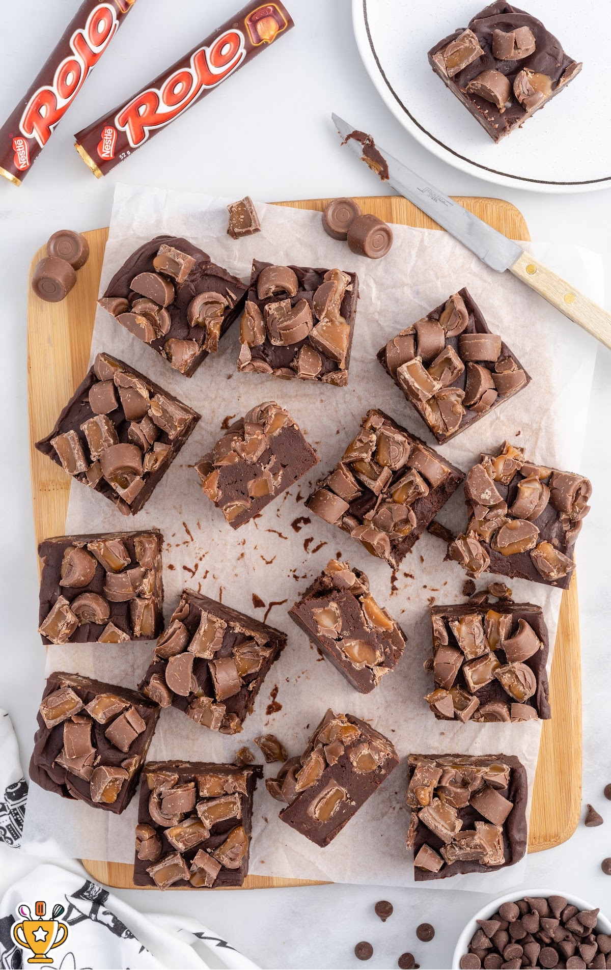 Rolo Fudge cut into pieces on a wooden board