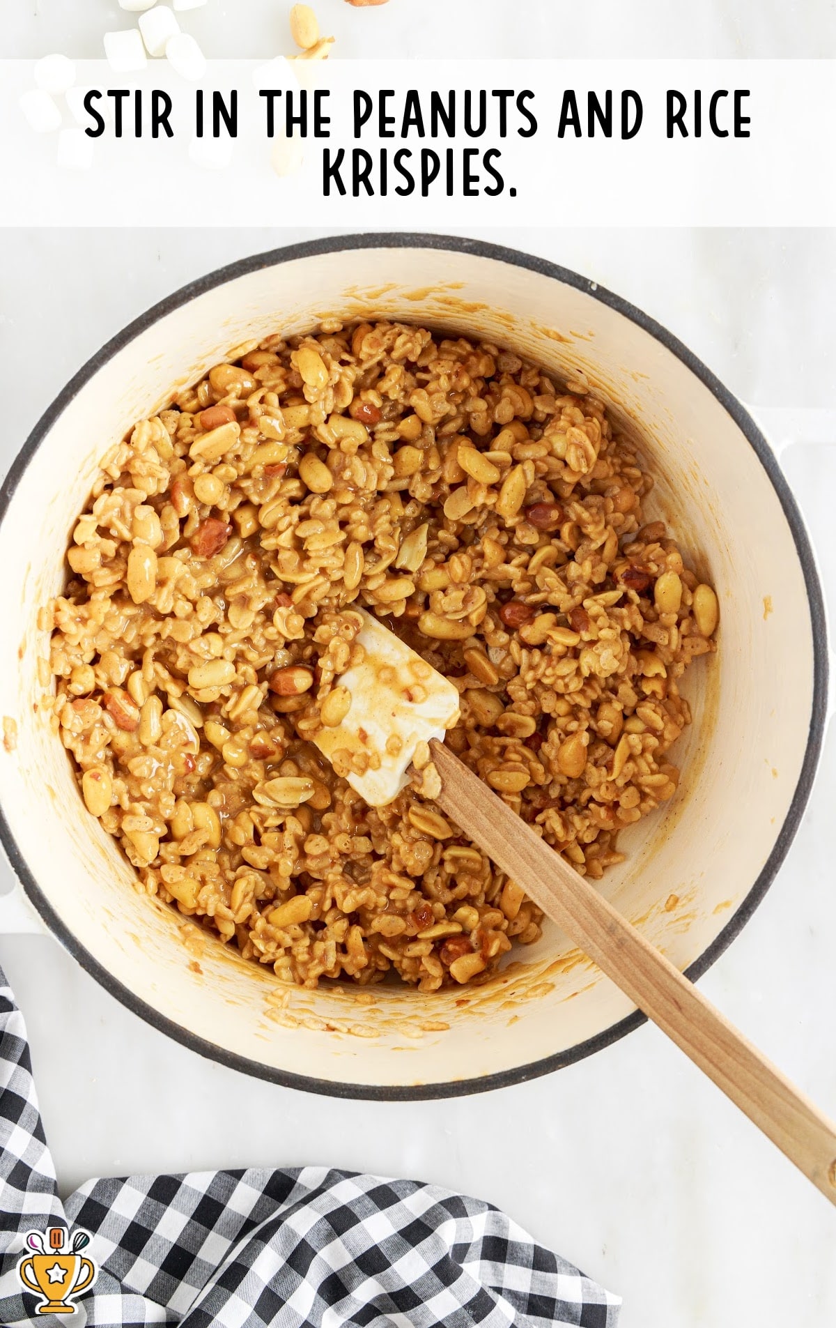 Peanuts and rice krispies stirred in the mixture