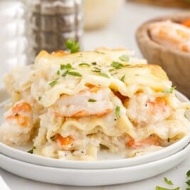 Seafood Lasagna on two plates stacked together