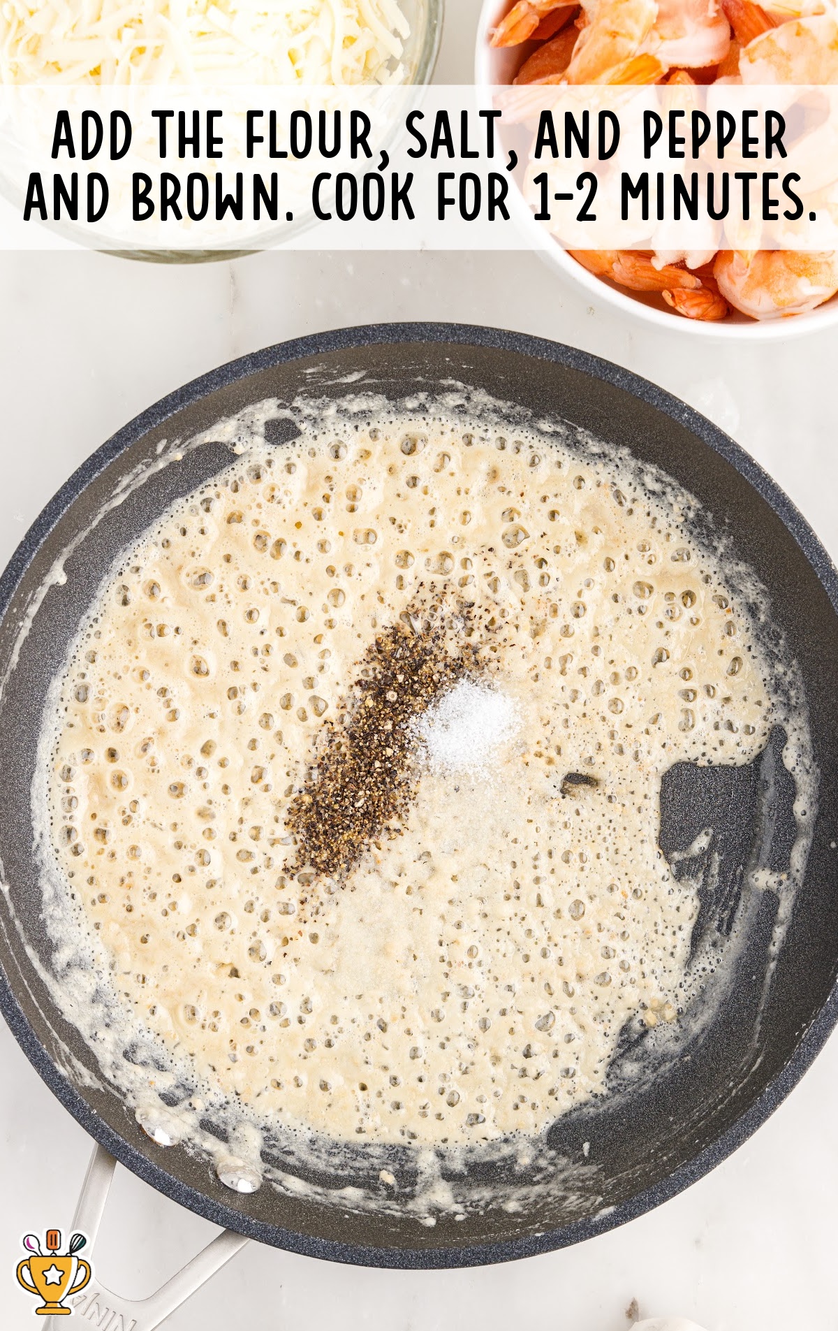 flour, salt, and pepper added in a frying pan