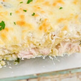 A closeup picture of White Chicken Lasagna in a clear glass baking pan