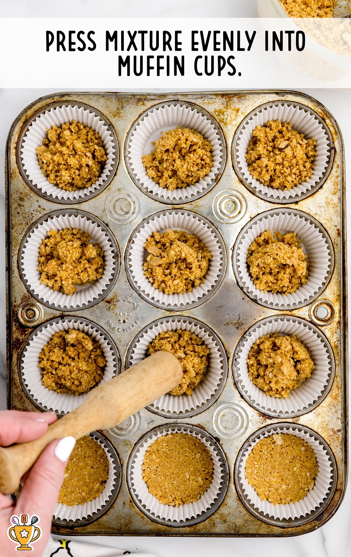 Putting mixture into muffin cups