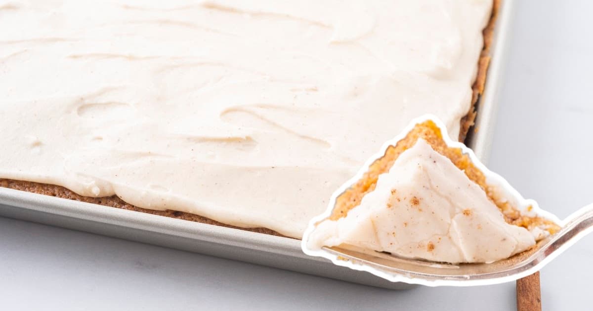 A fork holding a piece of Pumpkin Sheet Cake