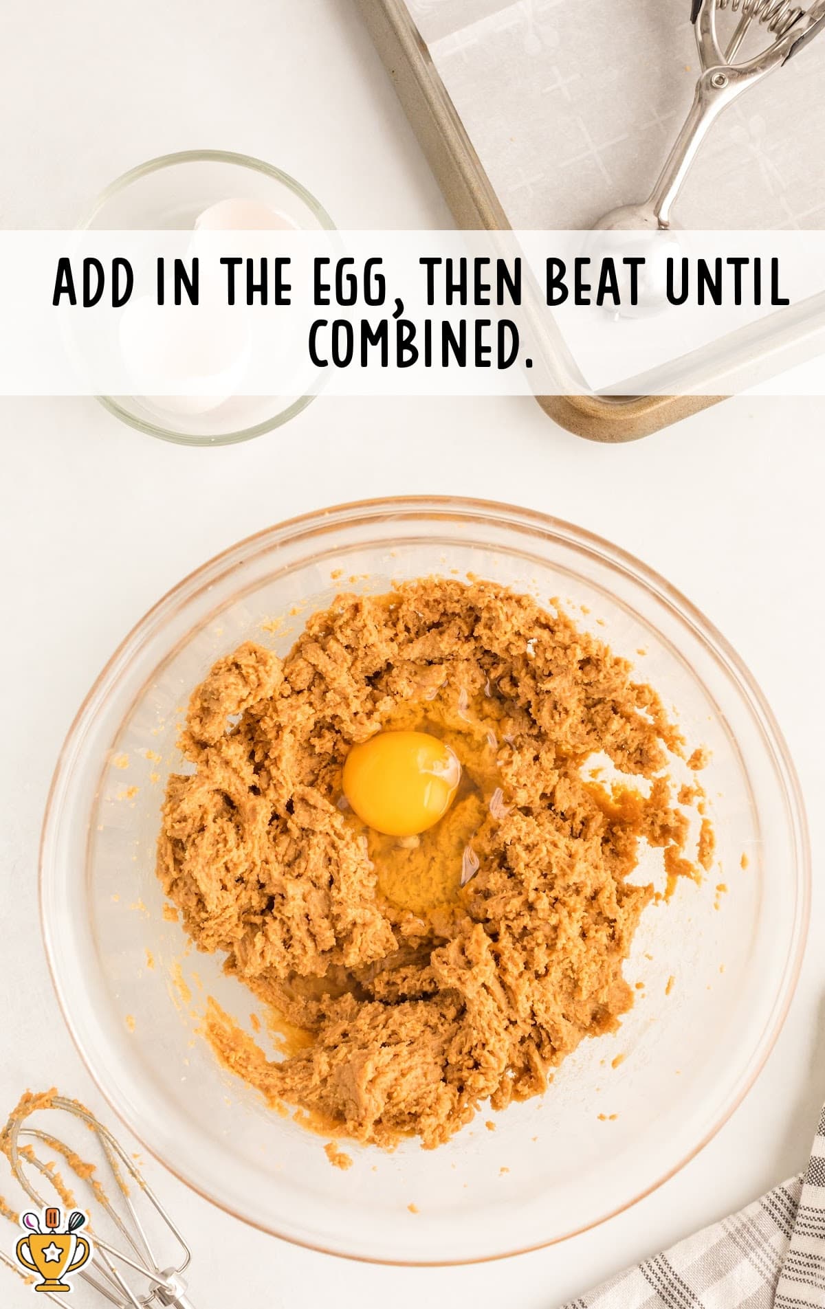 egg added in a a bowl of mixture