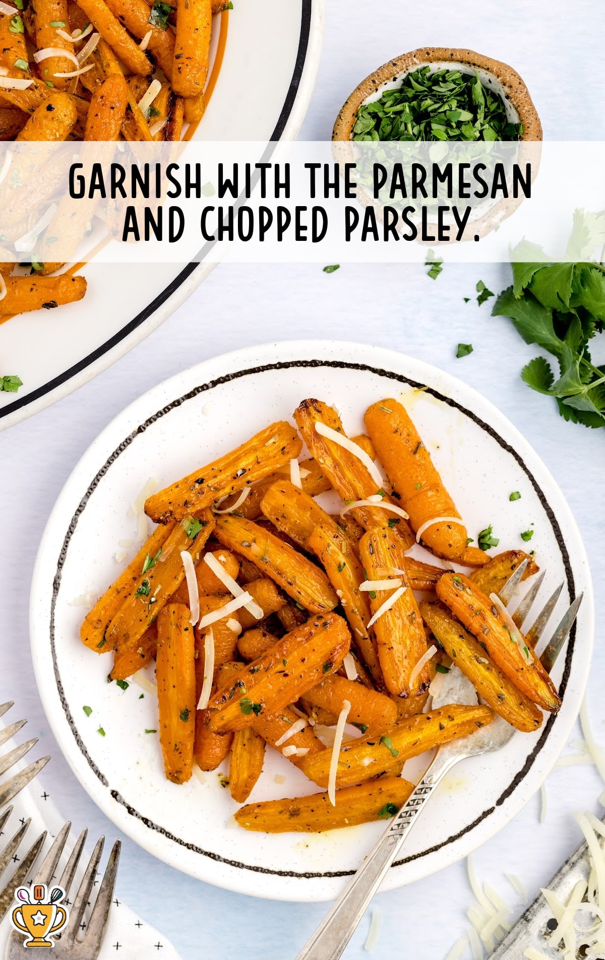 Air Fryer Carrots on a plate garnished with parmesan and chopped parsley