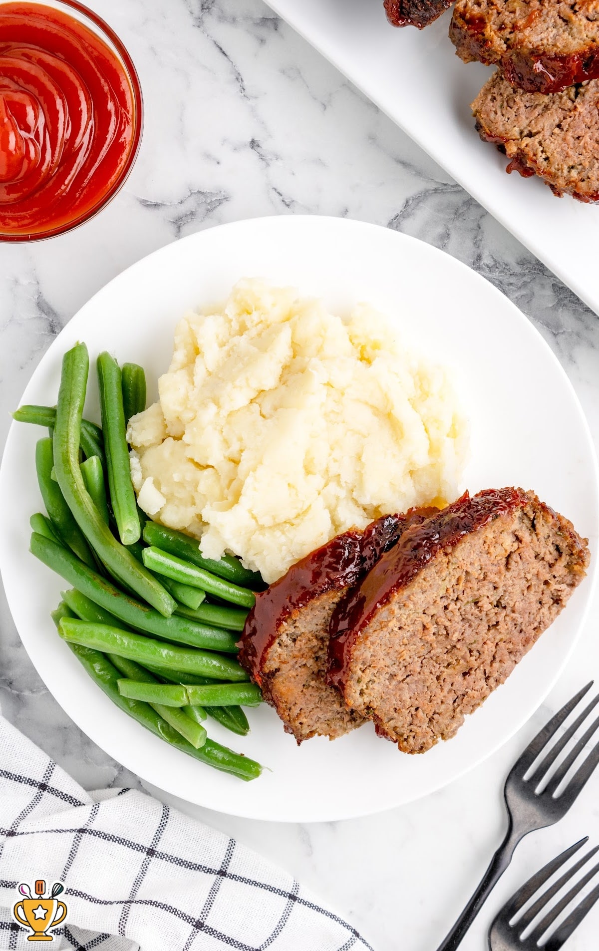 Air Fryer Meatloaf on a plate with green beans