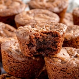 A Brownie Bite with a bite on it and a bunch of others