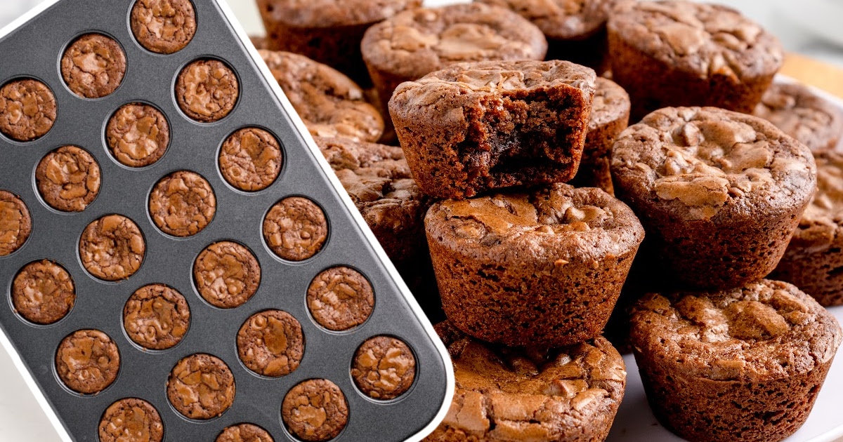 A bunch of Brownie Bites, one with a bite, others in a baking tin