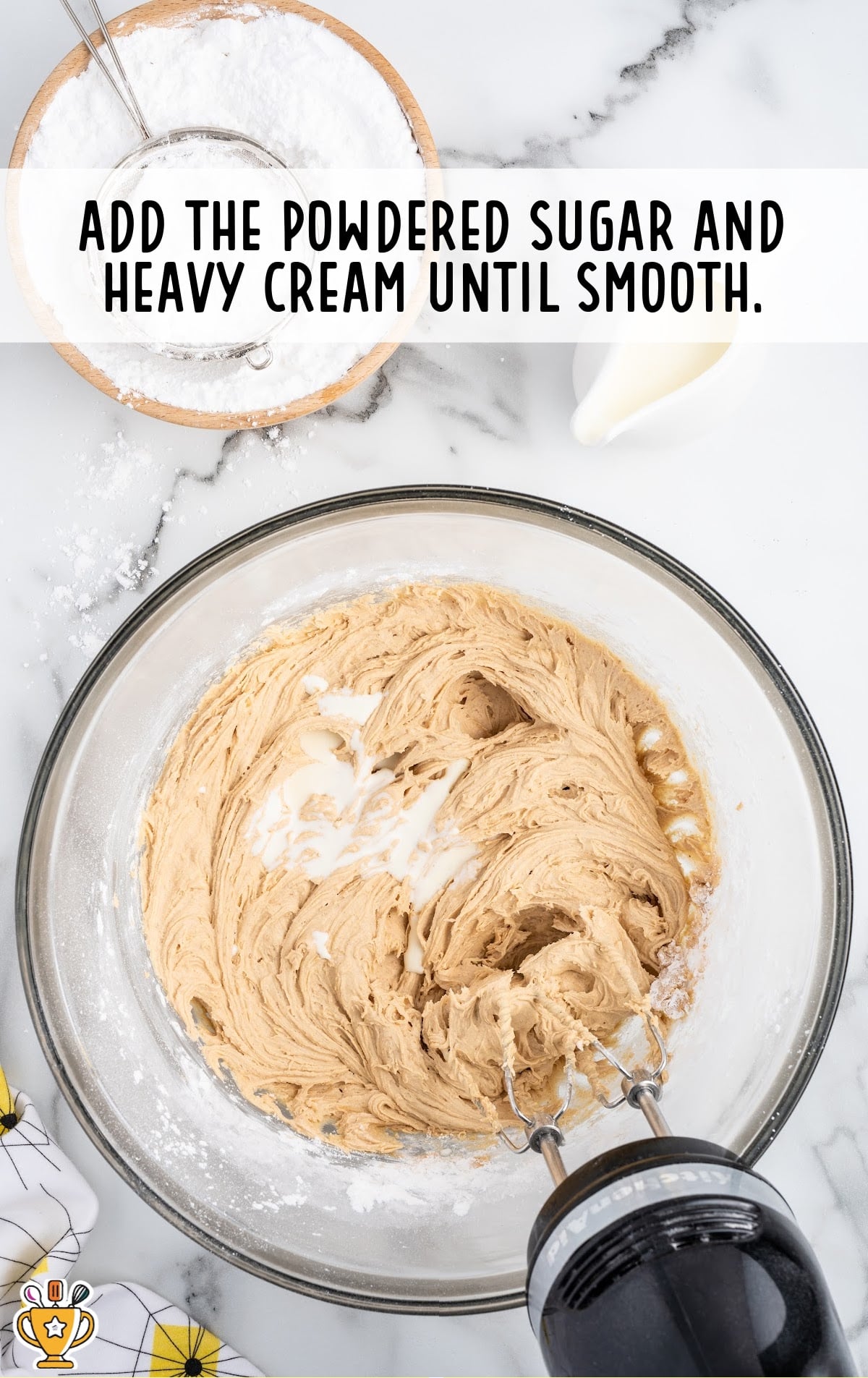 Ingredients for making Butterfinger Cupcakes in a bowl with a mixer