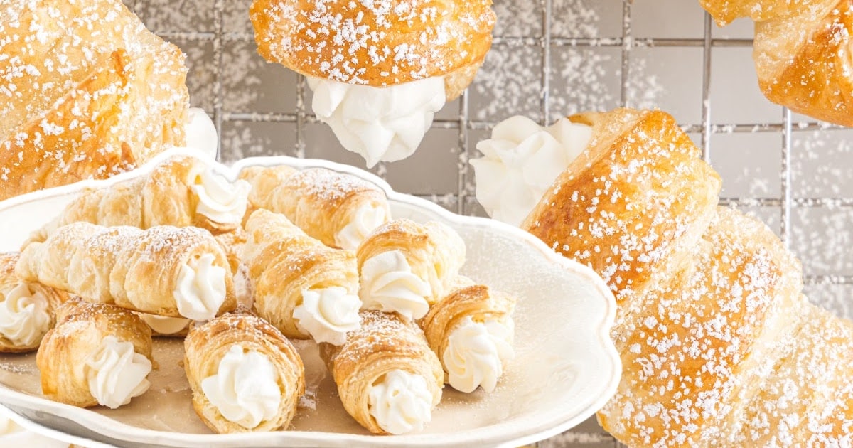 a plate of cream horns next to a cooling rack