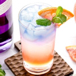 A garnished empress gin cocktail.