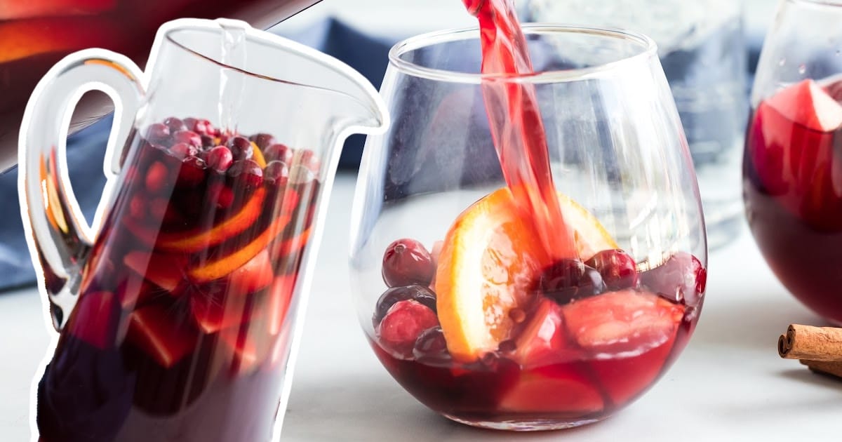 A jar full of Fall Sangria and a glass of Fall Sangria