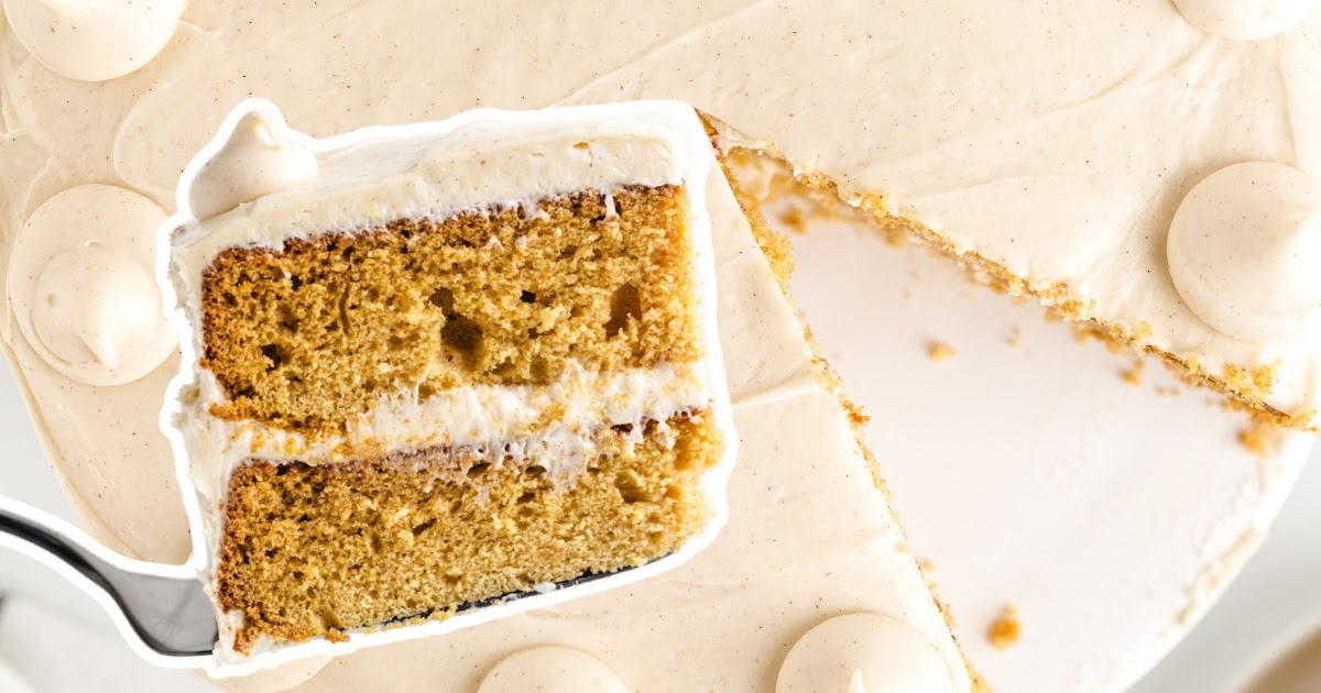 Gingerbread Cake with a missing piece and a fork holding a piece of Gingerbread Cake