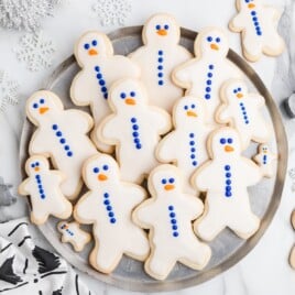 Gingerbread Man Sugar Cookies on a stainless steel plate