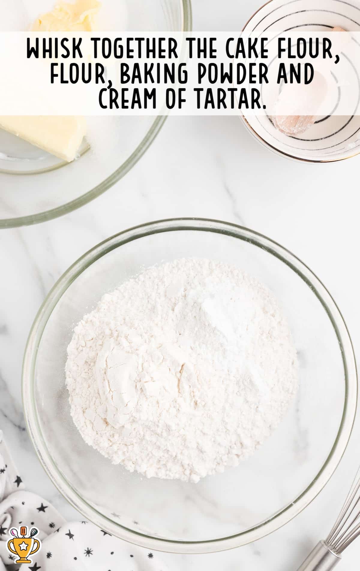 cake flour, flour, baking powder and cream of tartar mixed in a bowl