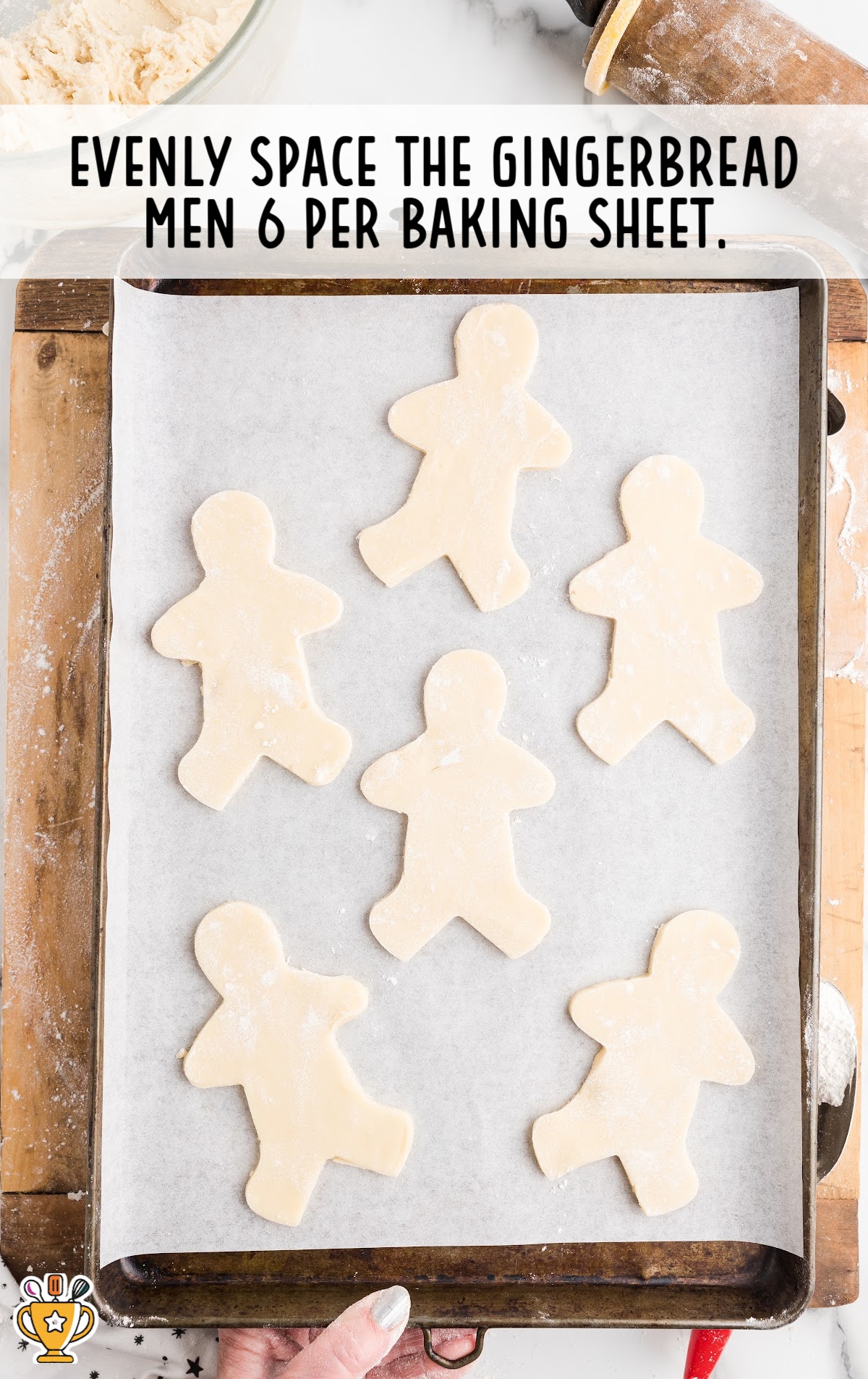 Gingerbread Men placed on a baking sheet
