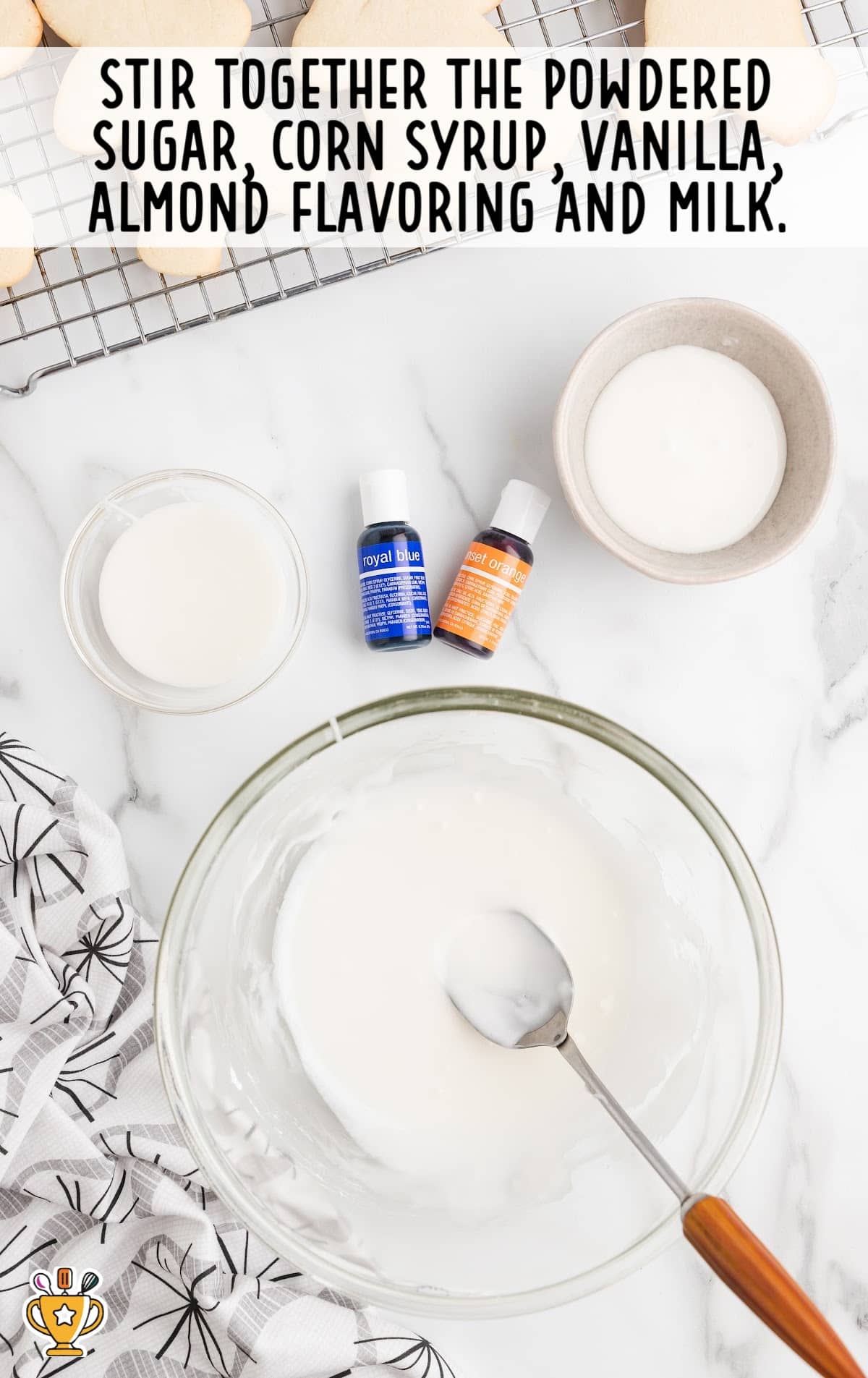 powdered sugar, corn syrup, vanilla, almond flavoring and milk mixed in a bowl